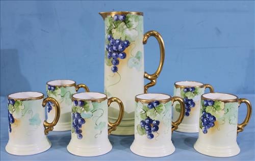 7 piece hand painted Limoges tankard set, 13.5 in. T. (1 of 3)
