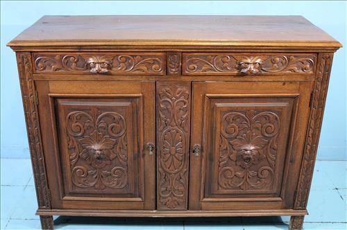Heavily carved oak sideboard with carved lion head pulls (1 of 5)