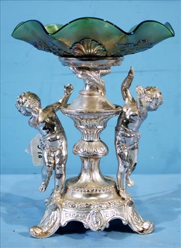 Metal center piece with cupids holding glass bowl, 11 in. T.: Metal center piece with 2 cupids holding depression glass bowl, 11 in. T, 9 in. W.