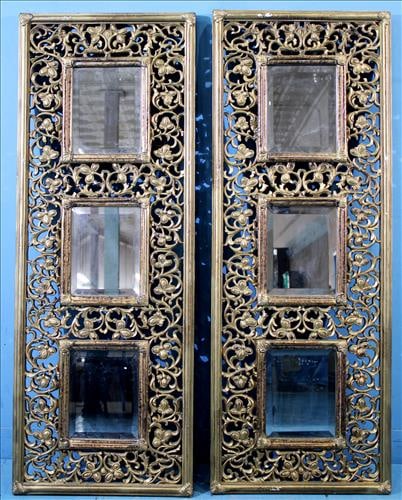 Pair of pierce carved wall mirrors with beveled glass, 51 x 19: Pair of pierce carved wall mirrors with beveled glass, 51 x 19