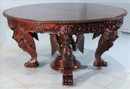 Heavily carved Horner dining table w figural angels support