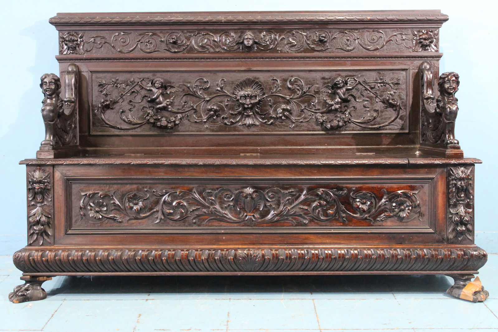 Mahogany hall seat by R.J. Horner with figural arms and faces (1 of 9)