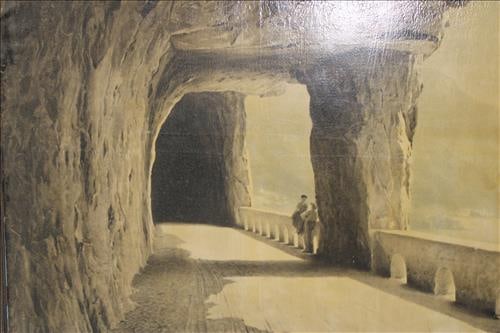 Large oil on canvas of a covered stone walkway, 60.5 x 103.5: Large oil on canvas of a covered stone walkway with people sitting on railing, 60.5 x 103.5