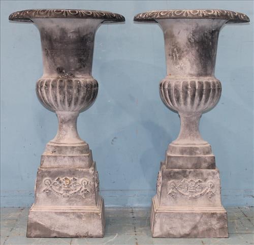 Pair of 2 piece gray cast iron urns on stand, 42 in. T, 22 in . D.: Pair of 2 piece gray cast iron urns on stand, 42 in. T, 22 in . D.