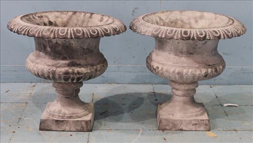 Pair of small gray cast iron urns with fluted sides, 19 in. T, 18 in. R. (1 of 1)