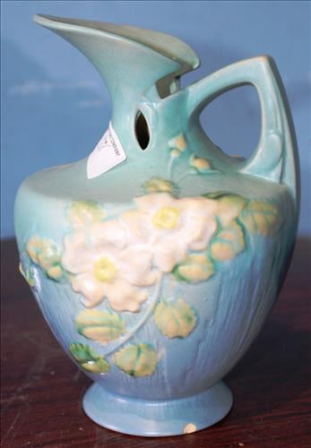 Blue hand painted water pitcher with handle, signed Roseville: Blue hand painted water pitcher with handle and hand painted flowers, signed Roseville