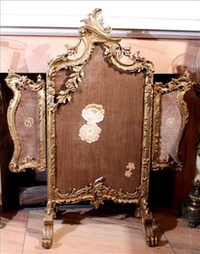 Triple wooden fire screen with ornate carving and gold gilt paint