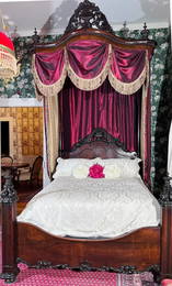 Rosewood three-quarter rococo plantation bed by Mallard with original mosquito nets