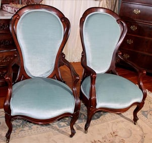 Pair of double arm Belter side chairs with blue velvet upholstery, 42 in. T, 23 in. W, 20 in. D.