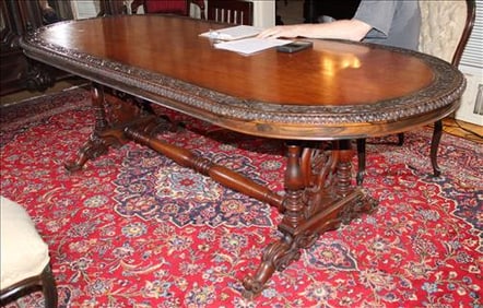 Solid rosewood oval dining table with carved band, 30 in. T, 94 in. L, 38 in. W.