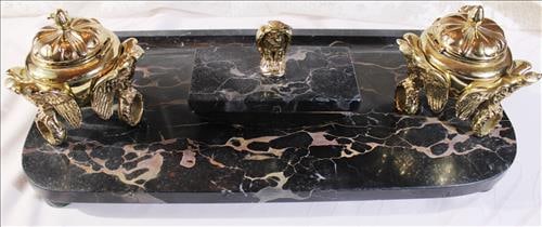 Double polished brass ink well set on black marble base, 6 in. T, 19 in. W.