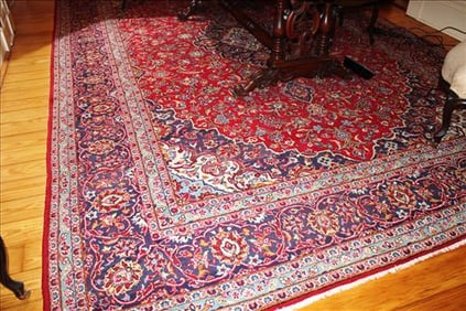 Antique Persian rug with red, blue and tan, signed Iran, 14 ft. 2 in. x 9 ft. 6 in.