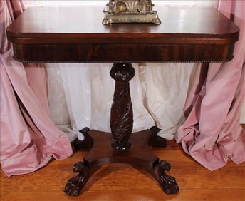 Mahogany acanthus carved game table with claw feet