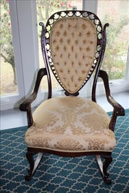 Rare mahogany rocker with heart shape back and open pierce carving