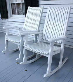 Pair of white wood porch rockers from front porch at Lauri Mundi
