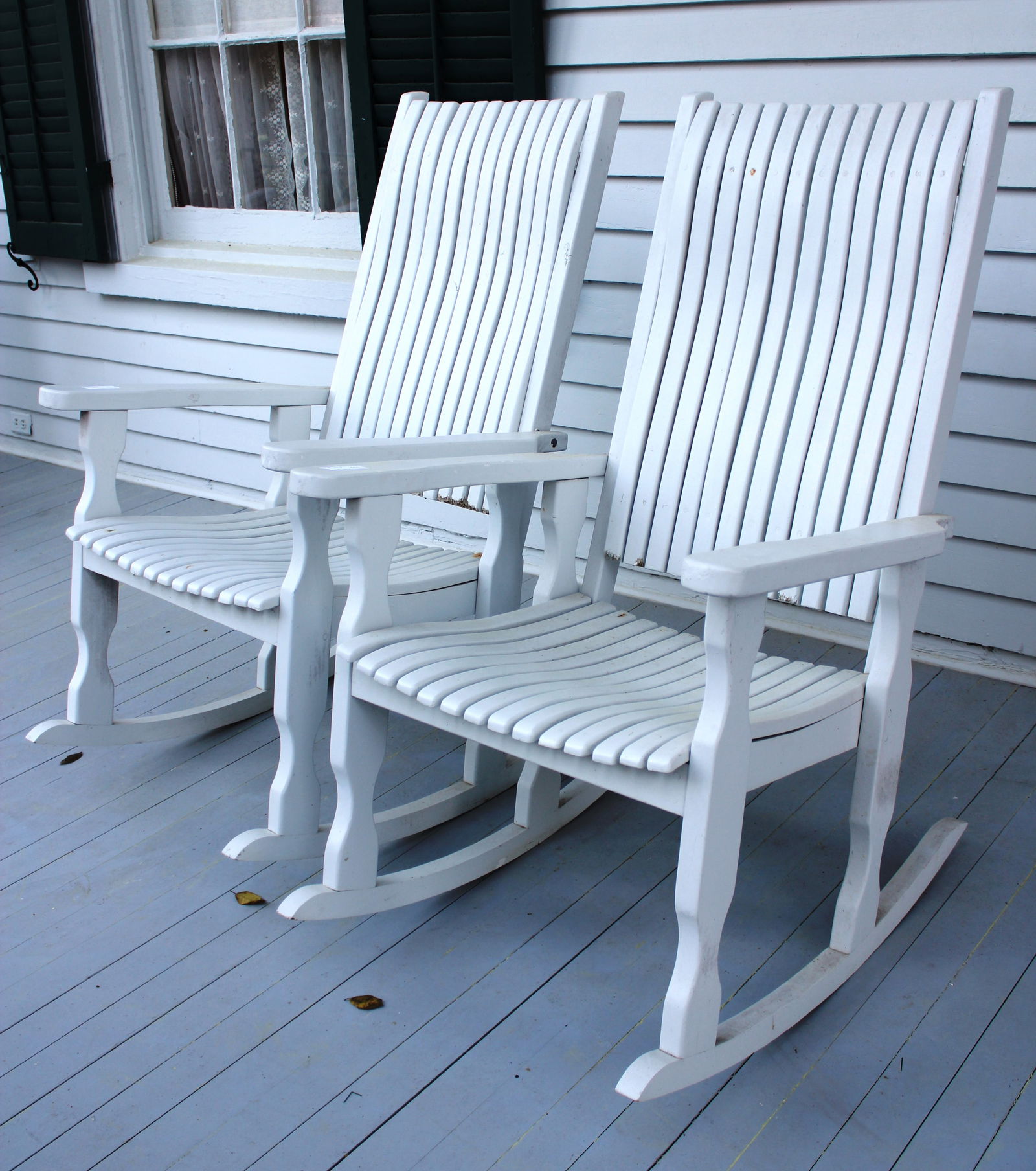 Pair of white wood porch rockers from front porch at Lauri Mundi (1 of 3)