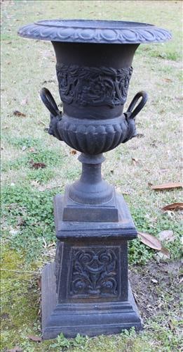 Pair of cast iron garden urns with handles and lions face: Pair of cast iron garden urns with handles and lions face, cones apart in 2 pieces, 40 in. T, 19 in. R
