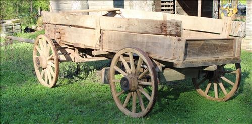 Old primitive horse drawn wagon with rear brakes, still useable