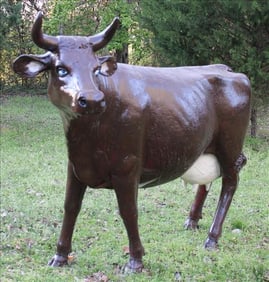 Fiber glass life size brown cow, 60 in. T, 72 in L.