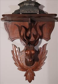 Walnut Victorian clock shelf with deer head, 14 in. L, 12 in. W.