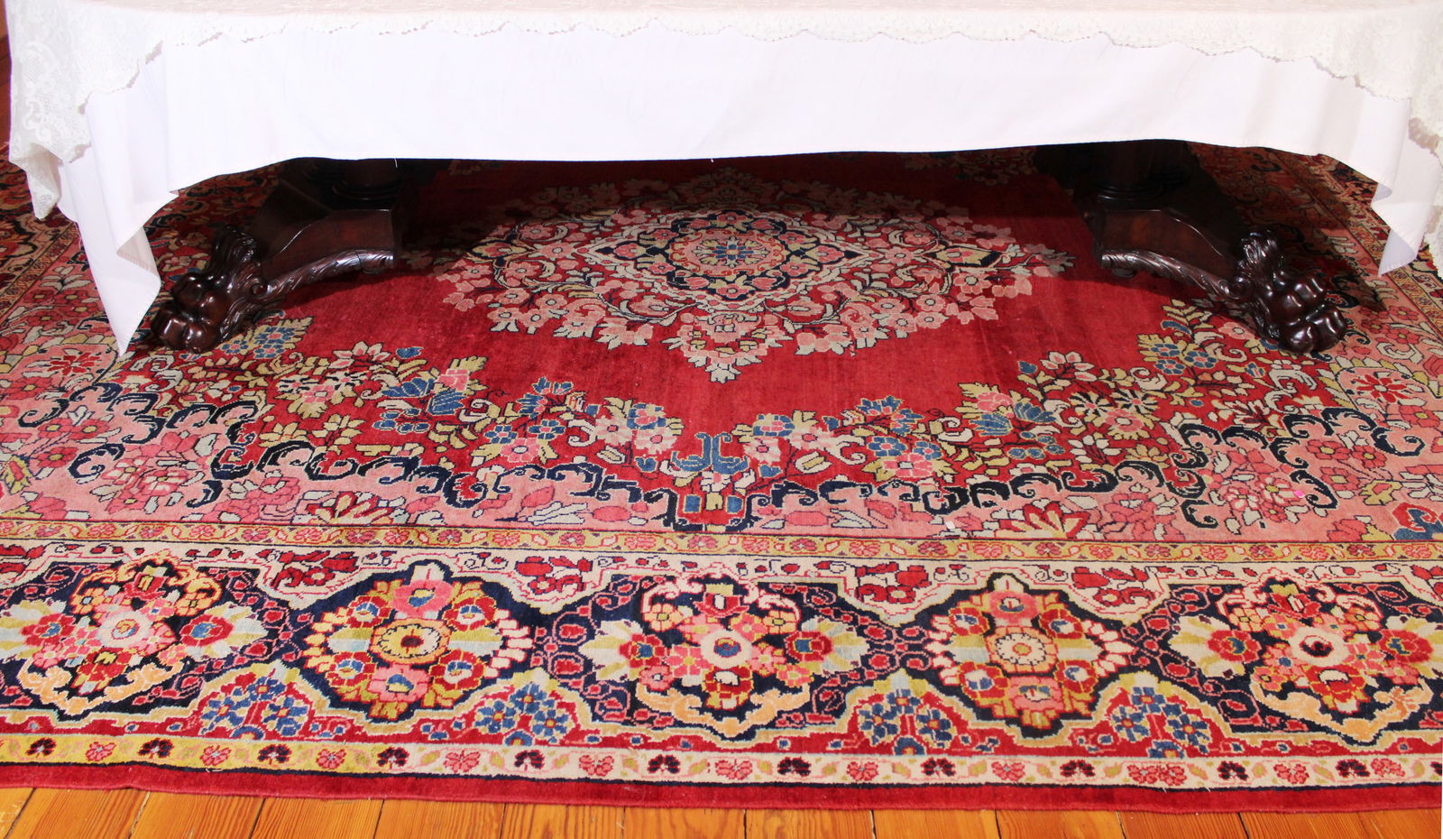 Antique hand made Persian rug, made in Iran with great colors: Antique hand made Persian rug, made in Iran with great colors of pinks and reds, even ware from dining room, 14 x 10 ft. 7 in.