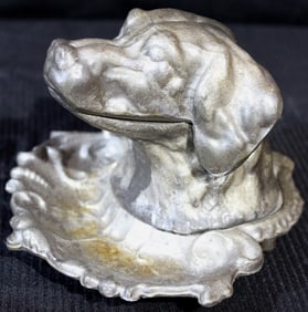 Dog head that opens for ink well made of metal, 5 in. T, 6 in. D.
