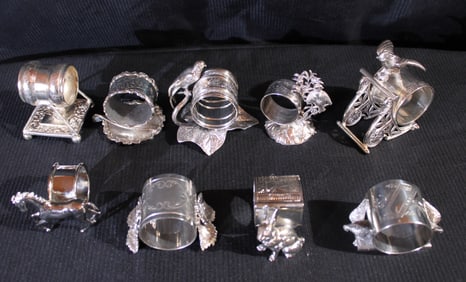 9 piece set of silver-plate Victorian napkin holders