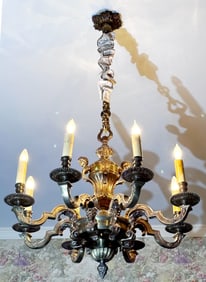 8 light solid brass chandelier with angel heads at top, 42 x 31