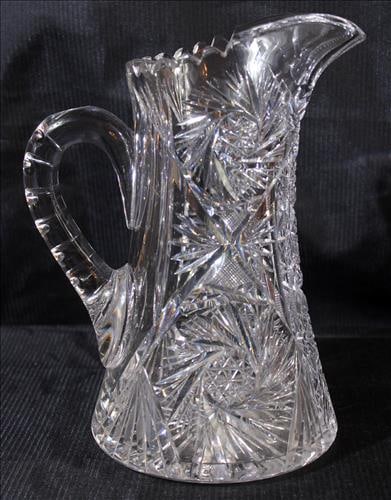 Very heavy pin wheel cut pitcher in good condition, 11 in. T, 6 in. W.: Very heavy pin wheel cut pitcher in good condition, 11 in. T, 6 in. W.