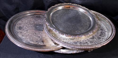 4 silver-plate serving trays with 1 footed, water pitcher