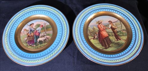 2 Royal Vienna hand decorated plates with blue and gold rims