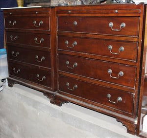 Matched pair of mahogany bachelor chest with slides