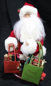 Santa Loaded with bags of presents on wooden base, 15 in. T.