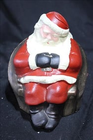 Santa piggy bank, sitting in chair asleep, 7 in. T.