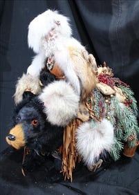 Mountain Man Christmas, riding a black bear, 21 in. T, 19 in. L.