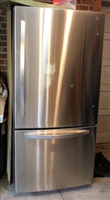Stainless steel L.G. refrigerator with freezer in bottom, like new