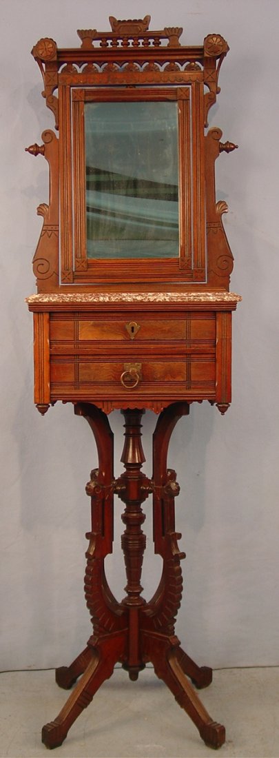 Walnut Eastlake Shaving Stand, very ornately carved, 2 : Walnut Eastlake Shaving Stand, very ornately carved, 2 drawers, brown marble top, 71in. T, 20in. W, 14in. D., ca. 1880