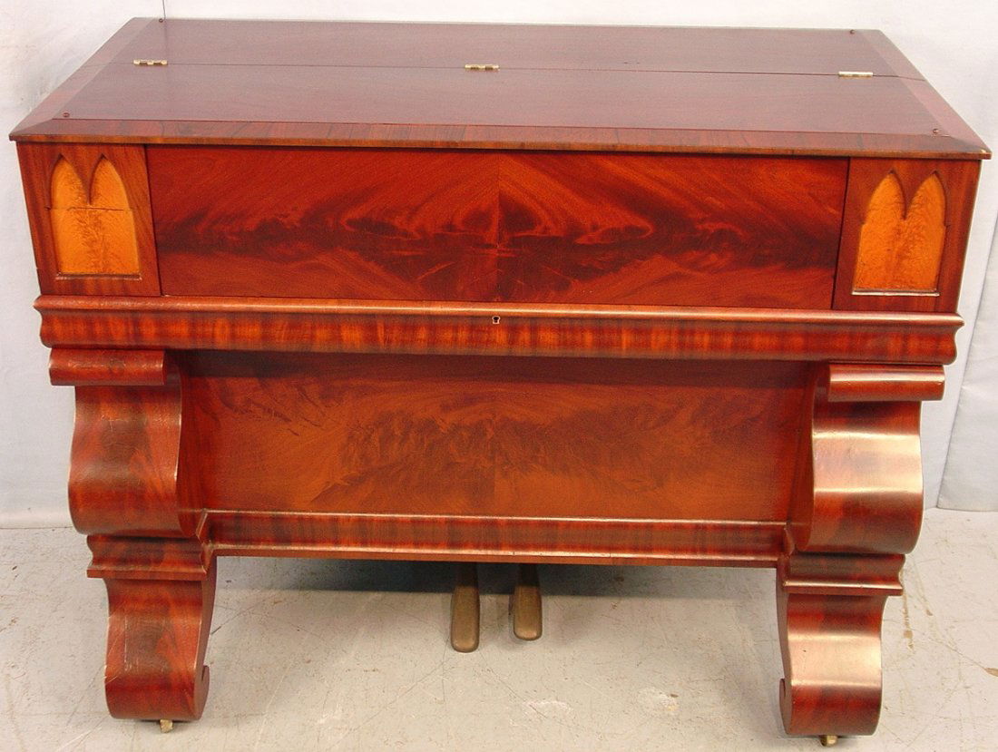 Empire Melodeon , recessed gothic panels of lighter col: Empire Melodeon , recessed gothic panels of lighter colored wood flanking keyboard, crotch and figural mahogany veneers, ca. 1880, 36in. T, 45in. L, 24in. D.