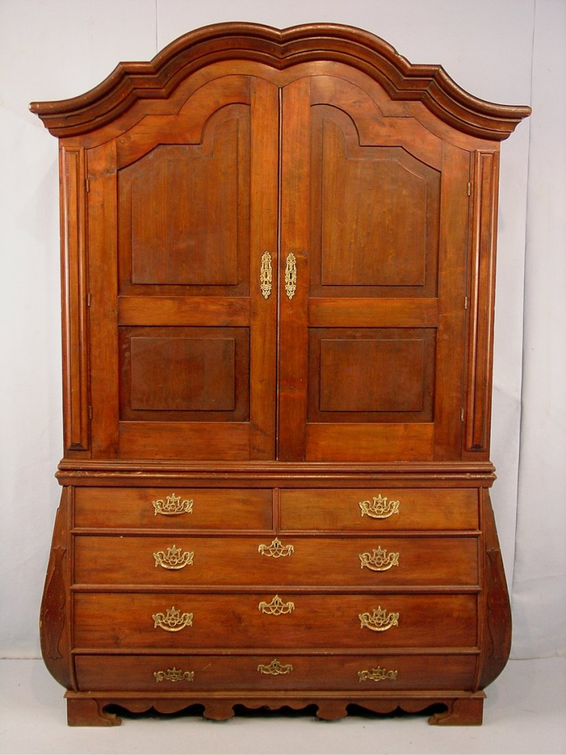 Early Dutch Walnut Linen Press with Bombay base, p: Early Dutch Walnut Linen Press with Bombay base, pegged together, ca. 1820, 88in. T, 60in. W, 21in. D.