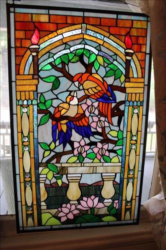 Matched pair of leaded stain glass windows, 35 in. T, 21 in. W.: Matched pair of leaded stain glass windows with parrots, 35 in. T, 21 in. W.