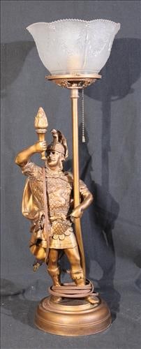 Metal newel post light with statue of Spanish soldier, 24 in. T.: Metal newel post light with glass shade, statue of Spanish soldier and gold paint, 24 in. T.