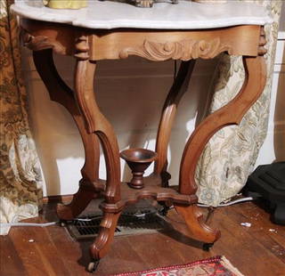 Walnut Victorian turtle top center table with white marble: Walnut Victorian turtle top center table with white marble, 29 in. T, 29 in. W, 23 in. D.