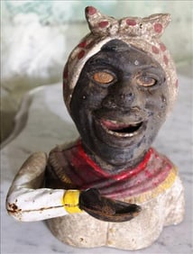 Cast iron mechanical bank of black mammy, 7 in. T, 6 in. W.
