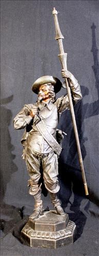 White metal statue of Spanish soldier holding flag pole, 29 in. T. (1 of 4)