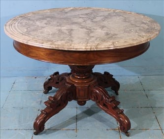 Victorian walnut marble top center table with beautiful carved base