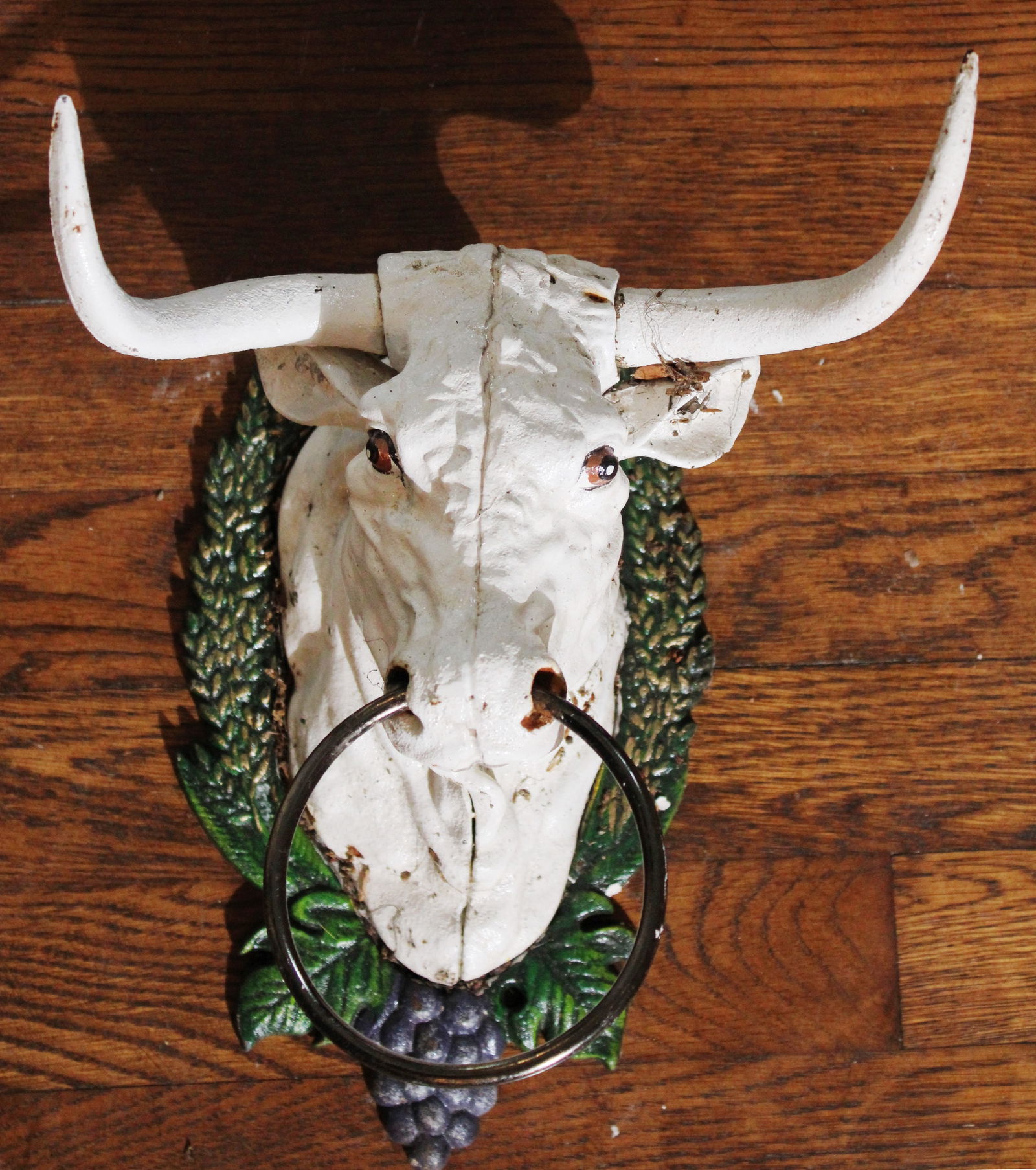 Cast iron doorstop with ornate hanger, 9 in. L, 7 in. W.: Cast iron doorstop with ornate hanger, 9 in. L, 7 in. W.