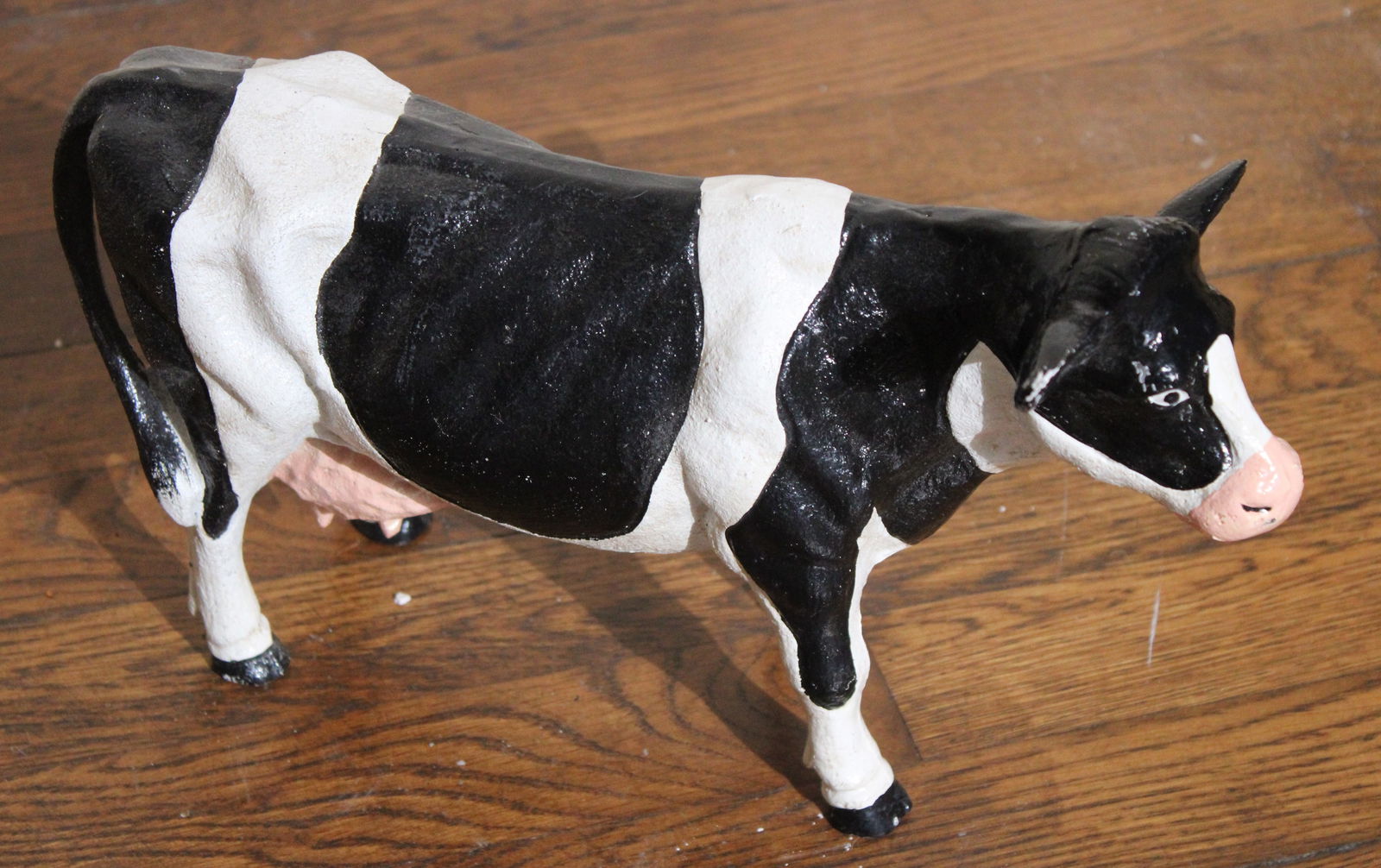 Heavy cast iron door stop in form of a cow: Heavy cast iron door stop in form of a cow