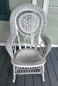 Antique white wicker rocking chair