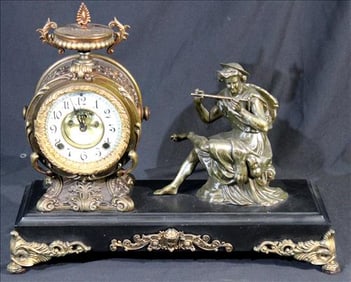 Contemporary figural mantle clock on black base by New Haven Co.