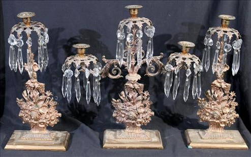 Set of 3 Victorian ornate girandoles, 16 in. H, 15 in. W, 4 in. D: Three-piece Victorian girandole set, each featuring elaborate gilt metal floral arrangements with scrolling foliate detail and hanging cut-glass prisms that catch and reflect the light beautifully. Th